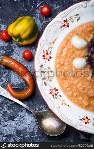 Gazpacho soup with basil. cold Gazpacho soup with tomato on slate background