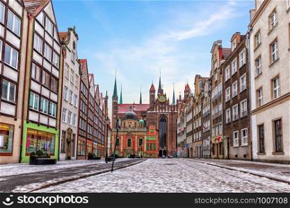 Gdansk street and the Royal chapel view in winter, Poland.. Gdansk street and the Royal chapel view in winter, Poland