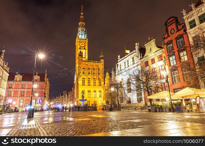 Gdansk Town Hall and the Fountain of Neptune in Long market, evening view.. Gdansk Town Hall and the Fountain of Neptune in Long market, evening view