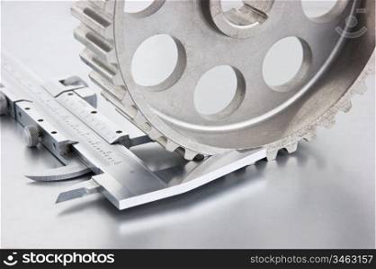 gear and callipers on a metal plate
