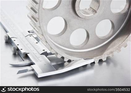 gear and callipers on a metal plate