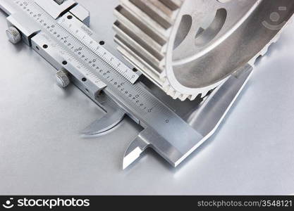 gear and callipers on a metal plate