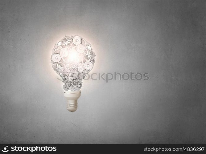 Gears light bulb. Conceptual image with light bulb and gears inside