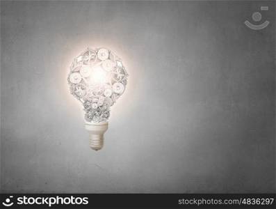 Gears light bulb. Conceptual image with light bulb and gears inside