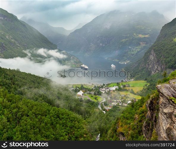 Geiranger Fjord overcast summer view from above Dalsnibba mount, Norway