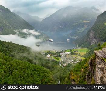 Geiranger Fjord overcast summer view from above Dalsnibba mount, Norway