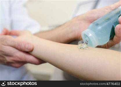 Gel being applied to patient's arm