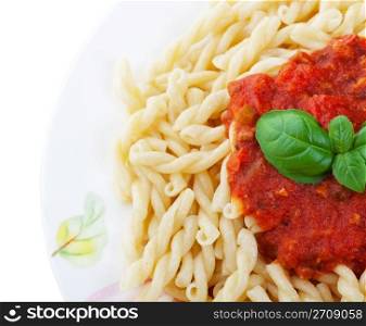 Gemelli Pasta with tomato sauce and fresh basil. Shot on white background.