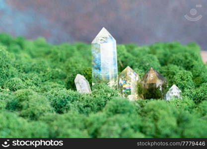 gemstones minerals on mysterious natural forest moss background, quartz and calcite crystals close up. Magic healing Rock for Reiki Crystal Ritual, Witchcraft, spiritual esoteric practice. Healing crystals on brown background