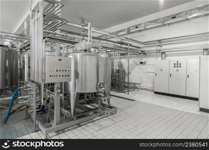 general view of the interior of a milk factory. equipment at the dairy plant. equipment at the milk factory