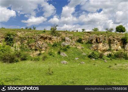 General view toward sedimentary rock in the field, Ludogorie, Bulgaria