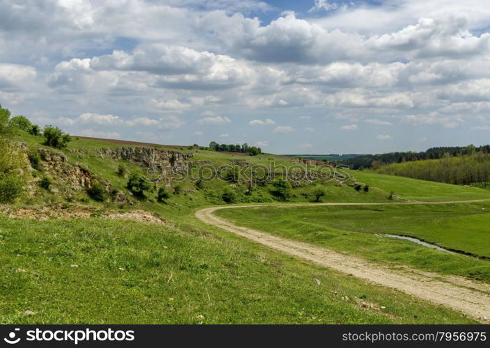 General view toward sedimentary rock in the field, Ludogorie, Bulgaria