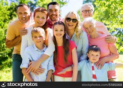 generation and people concept - happy family portrait in summer garden. happy family portrait in summer garden