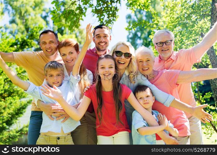 generation and people concept - happy family portrait in summer garden. happy family portrait in summer garden