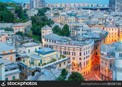 Genoa. Night view of the city.. Aerial view of the Genoa in night lighting at sunset.