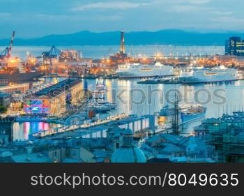 Genoa. Seaport night.. Aerial view of the sea port with night lighting in Genoa at sunset.