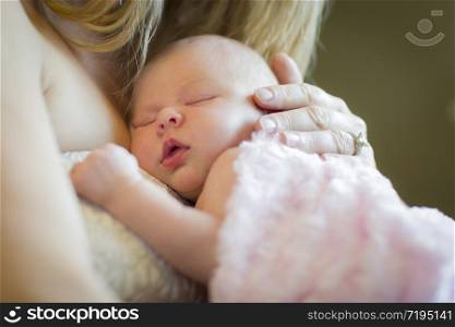 Gentle Hands of Mother Holding Her Precious Newborn Baby Girl.