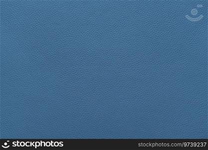 Genuine blue leather, eco friendly leatherette texture background. Material for upholstery and interior design, sport items and clothes. Wallpaper, banner, backdrop.