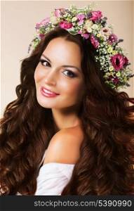 Genuine Young Woman with Flowing Healthy Hairs and Wreath of Flowers