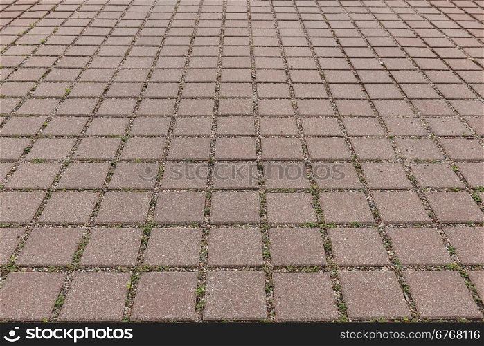 Geometric pattern of tiles in a suburban driveway