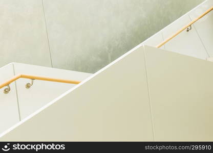 geometrical lines of granite staircase with railing