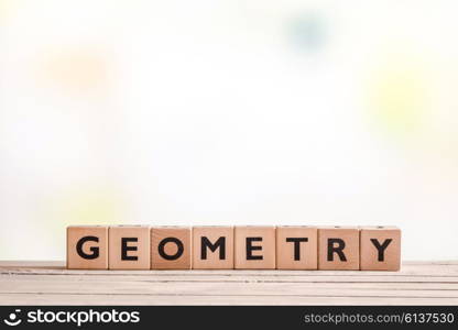 Geometry lessons sign on a classroom table