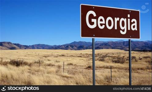 Georgia road sign with blue sky and wilderness