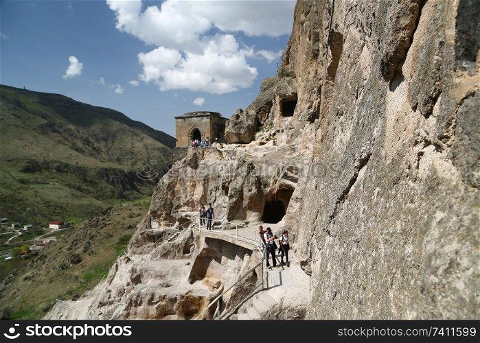 GEORGIA, VARDZIA-CIRCA MAY 2019--unidentified people near the antique cave and excavated city
