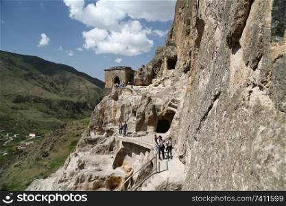 GEORGIA, VARDZIA-CIRCA MAY 2019--unidentified people near the antique cave and excavated city