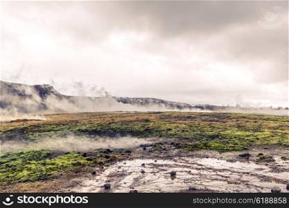 Geothermal activity in a landscape from Iceland in cloudy weather