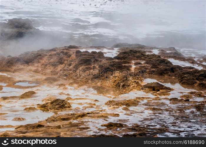 Geothermal surface with steam in icelandic nature