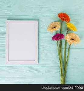 gerbera flowers with blank frame table