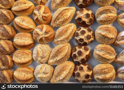 German bread rolls assortment. Diverse shapes of buns. Above view of many types of bread rolls. Buns in a variety of models. Traditional Bavarian buns