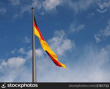 German flag. The national German flag of Germany over blue sky