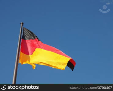 German flag. The national German flag of Germany over blue sky