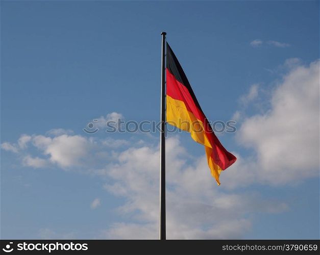 German flag. The national German flag of Germany over blue sky