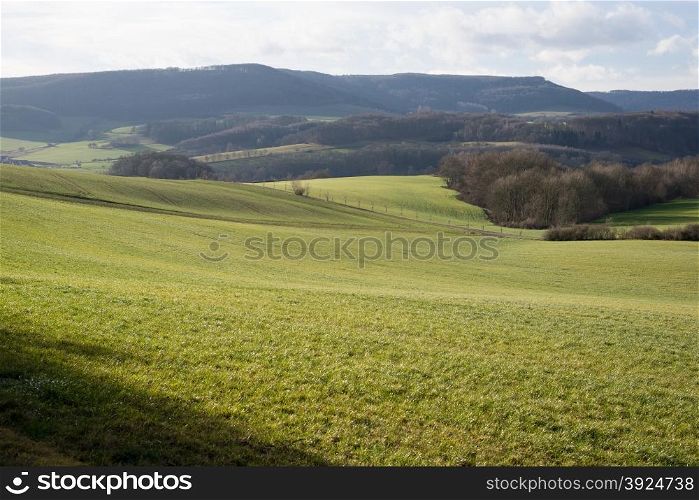 German landscape in Thuringia in winter with fields and forests