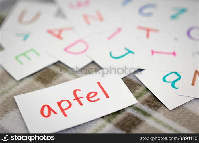 German; Learning the New Word with the Alphabet Cards (Translation; Apple)