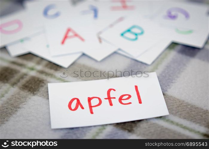 German; Learning the New Word with the Alphabet Cards; Writing APPLE