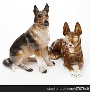 German Shepherds. Ceramic figurine, dog breed isolated on white
