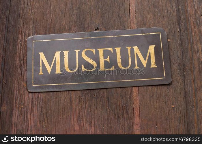 German sign with text museum (Museum) on a wooden wall