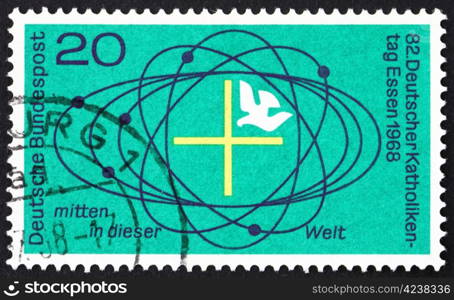 GERMANY - CIRCA 1968: a stamp printed in the Germany shows Cross and Dove in Center of Universe, 82nd Meeting of German Catholics, Essen, circa 1968