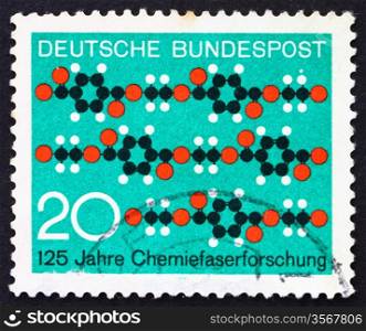 GERMANY - CIRCA 1971: a stamp printed in the Germany shows Molecule Diagram Textile Pattern, 125th Anniversary of Synthetic Textile Fiber Research, circa 1971