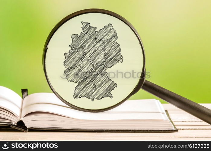 Germany With A Pencil Drawing Of A German Map In A Magnifying Glass — 5338