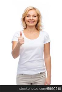 gesture, advertisement and people concept - smiling woman in blank white t-shirt showing thumbs up