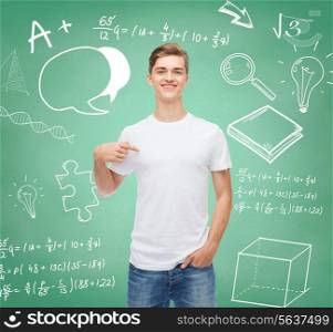 gesture, advertising, education, school and people concept - smiling young man in blank white t-shirt pointing fingers on himself over green board background with doodles