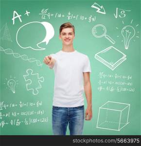 gesture, advertising, education, school and people concept - smiling young man in blank white t-shirt pointing at you over green board background with doodles