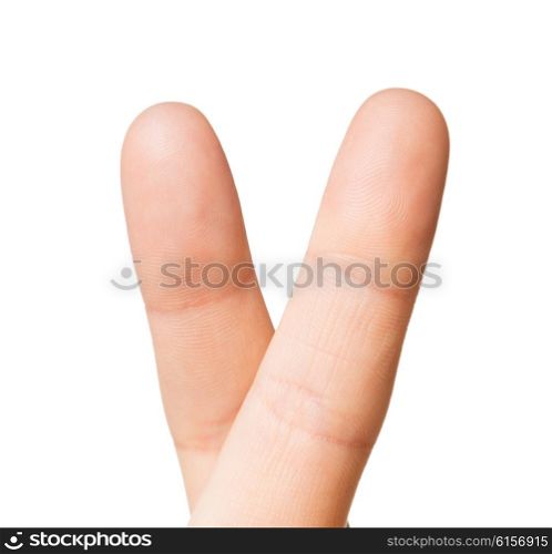 gesture and body parts concept - close up of hand showing two cross fingers. close up of hand showing two cross fingers