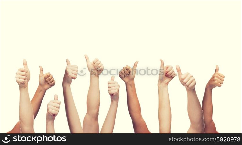 gesture and body parts concept - human hands showing thumbs up. human hands showing thumbs up
