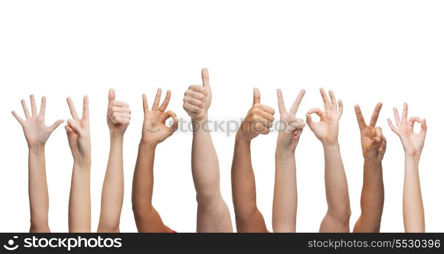 gesture and body parts concept - human hands showing thumbs up, ok and peace signs